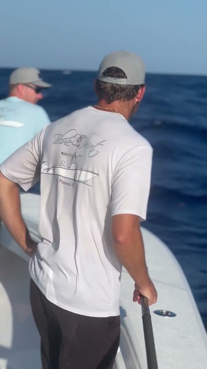 Printed crew tee worn aboard while fishing