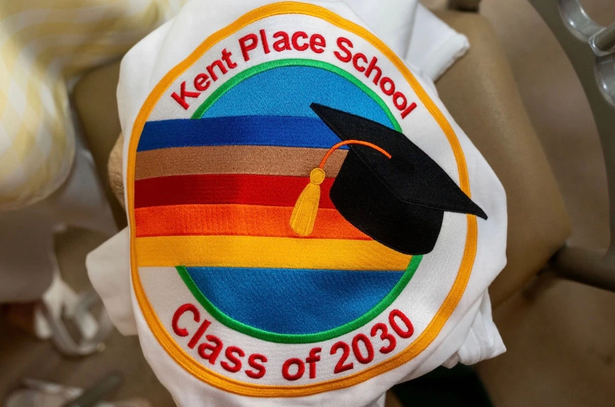 Detailed rainbow graduation embroidery on a Kent Place class hoodie